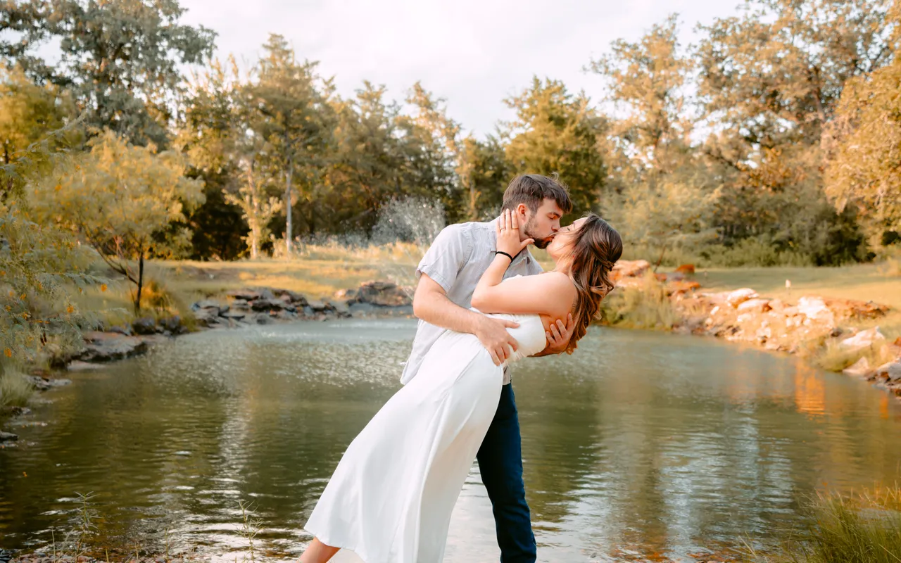 By the water, with the treeline going warm behind them